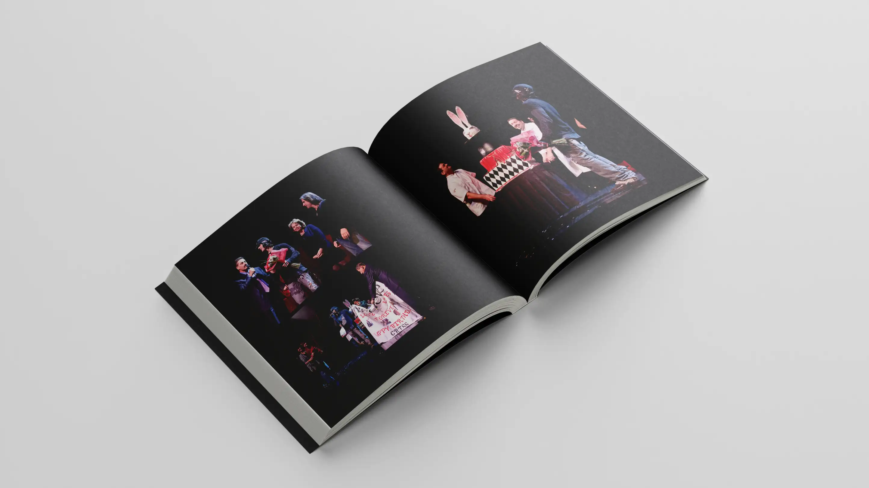 Book open to interior spread of photos from Criss Angel performance.